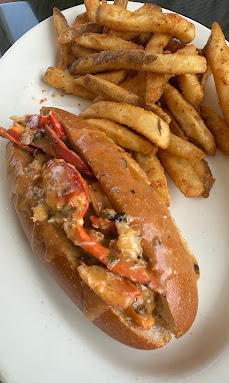 Lobster roll on a toasted brioche bun with hand-cut fries